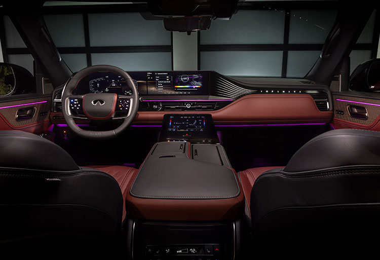 View of the dashboard area in dark red and purple in the inside of the 2025 INFINITI QX80.